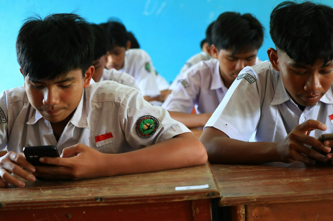 students coding together in classroom